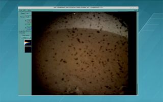 NASA's InSight Mars lander captured its first image just moments after touching down on the Red Planet on Nov. 26, 2018