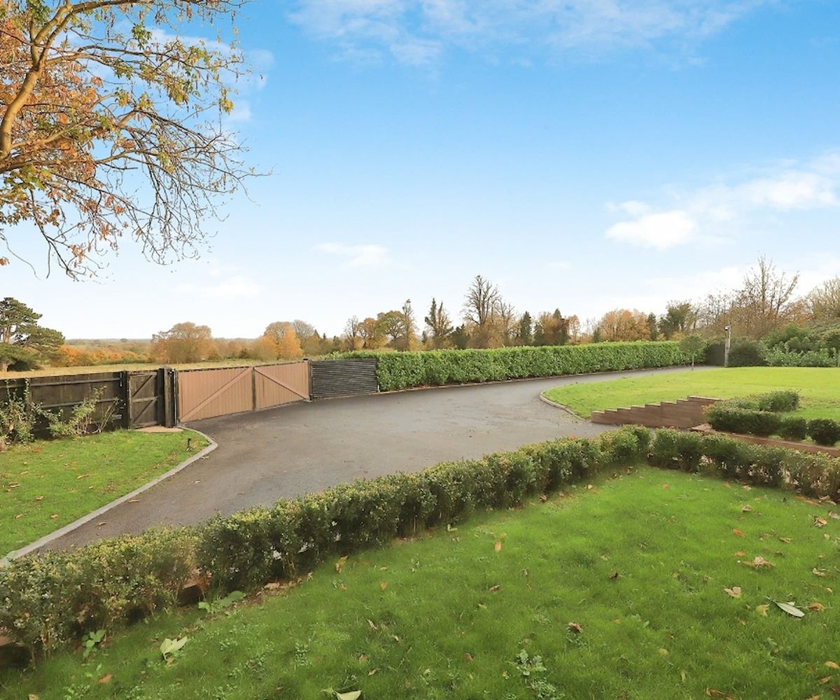 The front garden, hedge and wooden gate