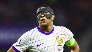  Kylian Mbappe of France with a protective face mask during the build up to the Spain vs France UEFA EURO 2024 semi-final. 