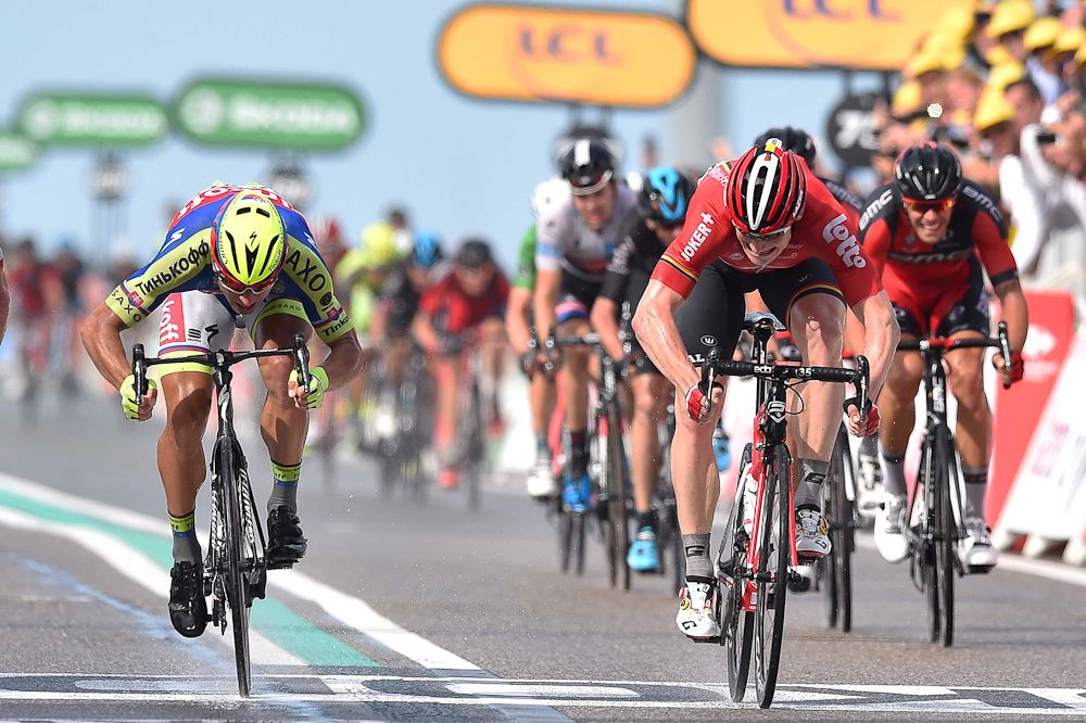 Andre Greipel wins stage 2 of the 2015 Tour de France by a bike throw over Peter Sagan.