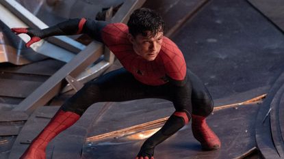 Tom Holland as Peter Parker unmasked and in the middle of a fight during a scene in Spider-Man: No Way Home