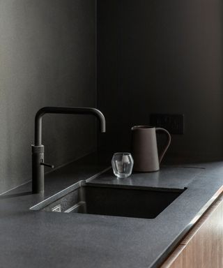 Design a kitchen sink with grey modern sink