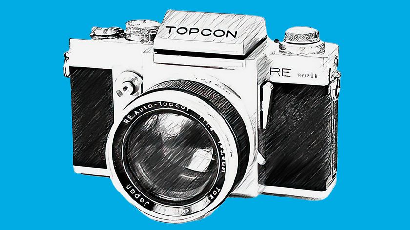 LIne drawing of Topcon RE Super 35mm SLR camera on a blue background