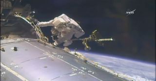 NASA astronaut Jack Fischer worked outside the International Space Station May 12 on his first-ever spacewalk.