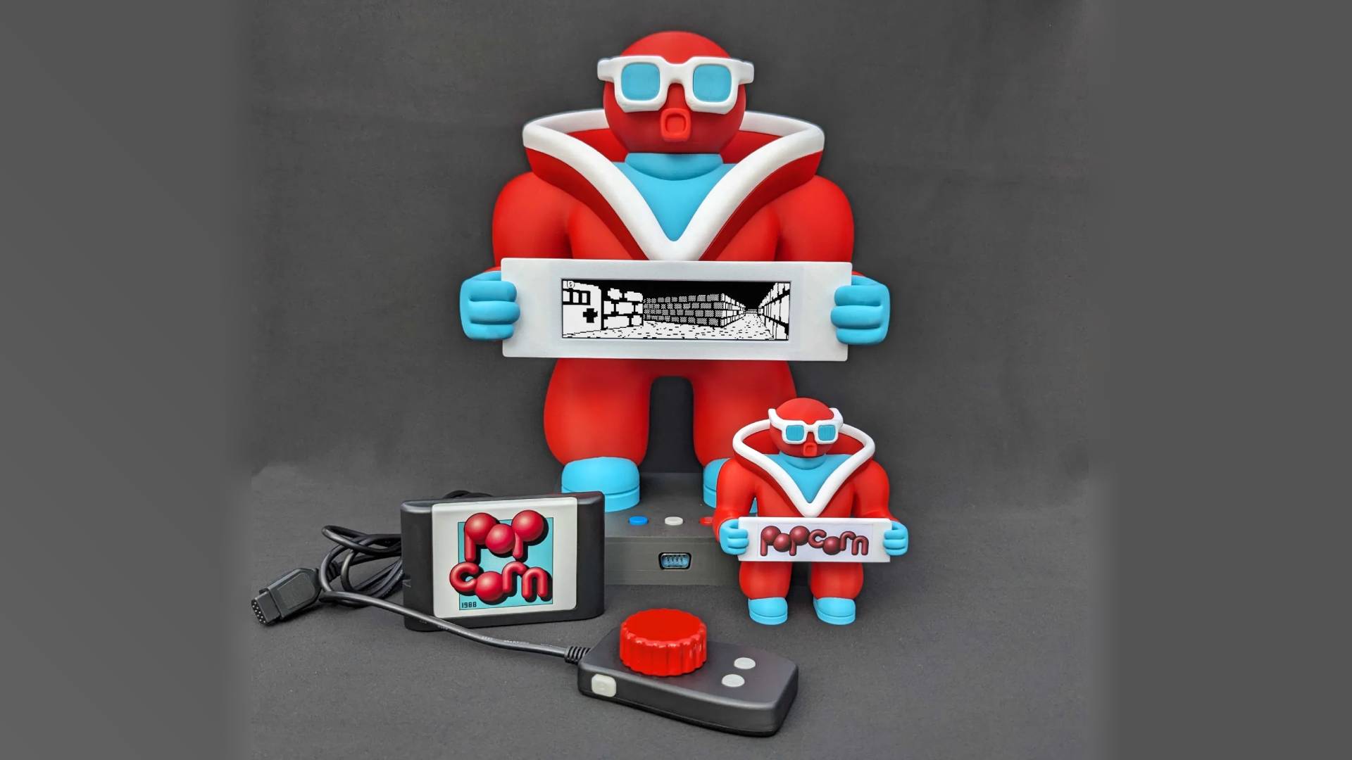 POPCORN Sega Mega Drive / Genesis cartirdge next to large and small Mr. Popcorn figures.