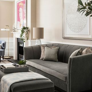 living area with grey sofa and lamp