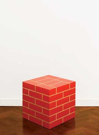 A cube made of red bricks.