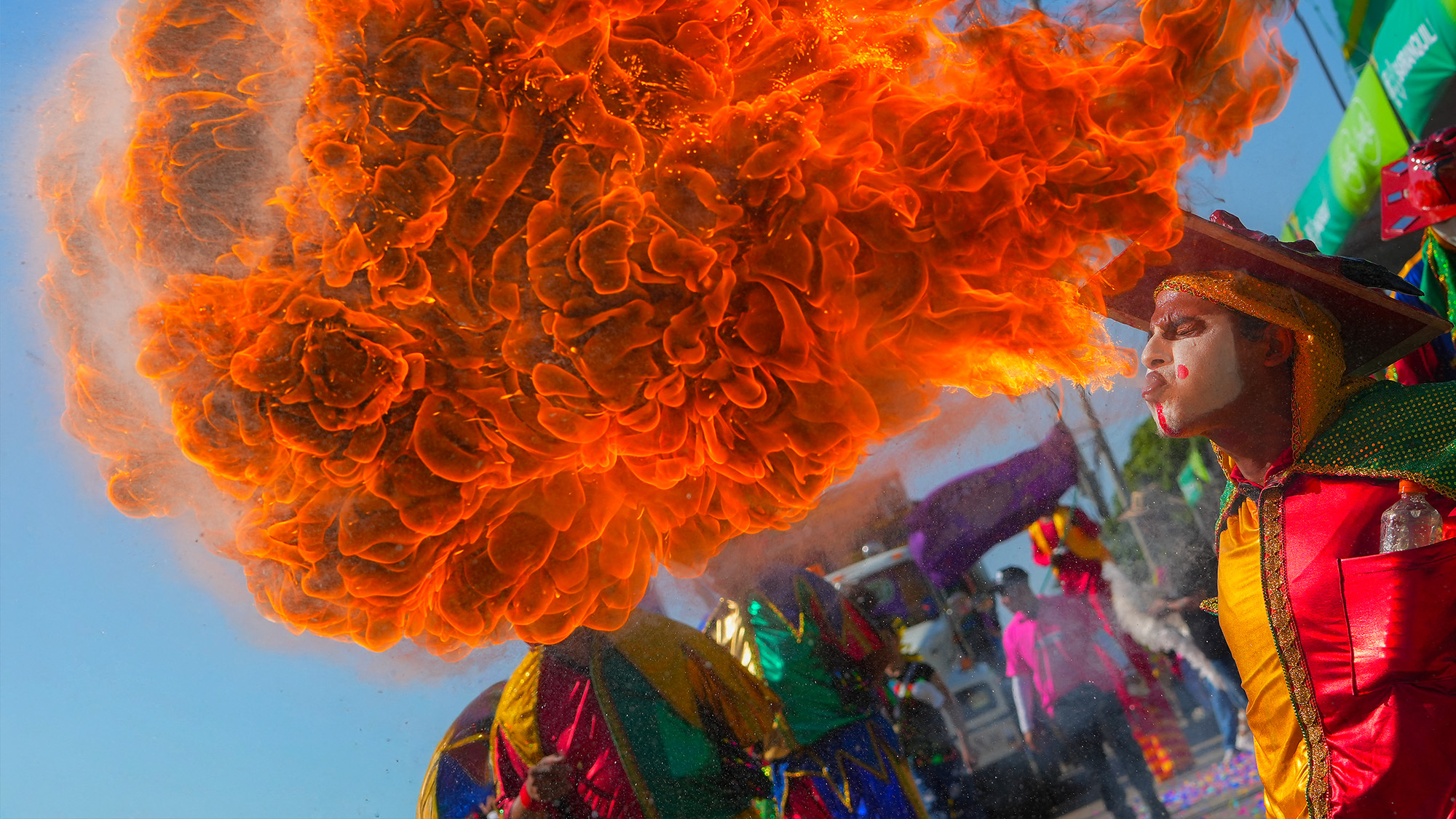 A performer breathes fire during the carnival parade in Barranquilla, Colombia
