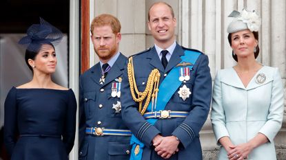 Prince William and Kate Middleton US trip, Meghan, Duchess of Sussex, Prince Harry, Duke of Sussex, Prince William, Duke of Cambridge and Catherine, Duchess of Cambridge watch a flypast to mark the centenary of the Royal Air Force from the balcony of Buckingham Palace on July 10, 2018 in London, England. 