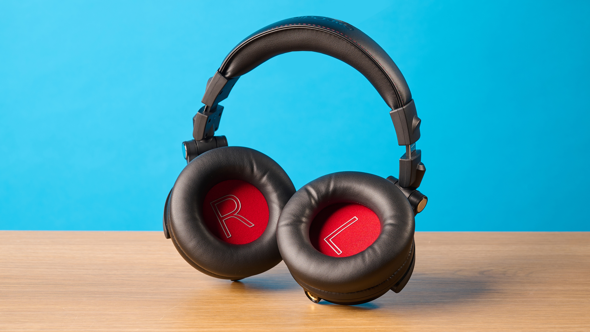 OneOdio Studio Max 2 in black photographed in front of a blue background
