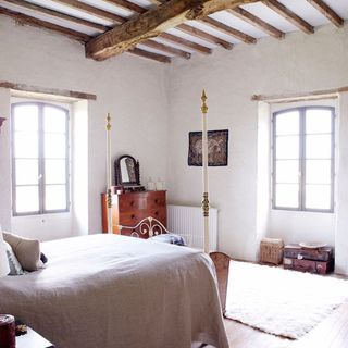 bedroom with white wall and white window and beams