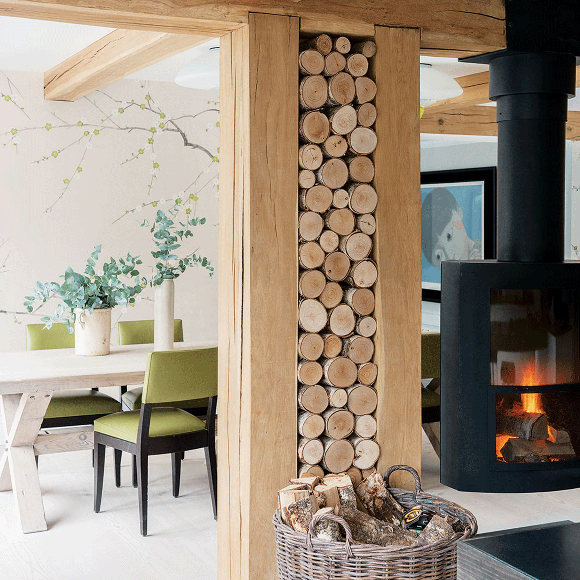 Wooden beams with log storage next to stove