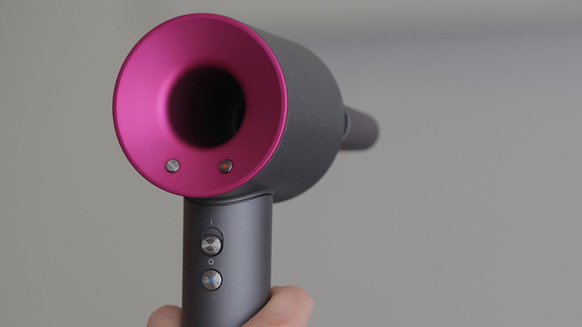 The Dyson Supersonic hair dryer being held upright