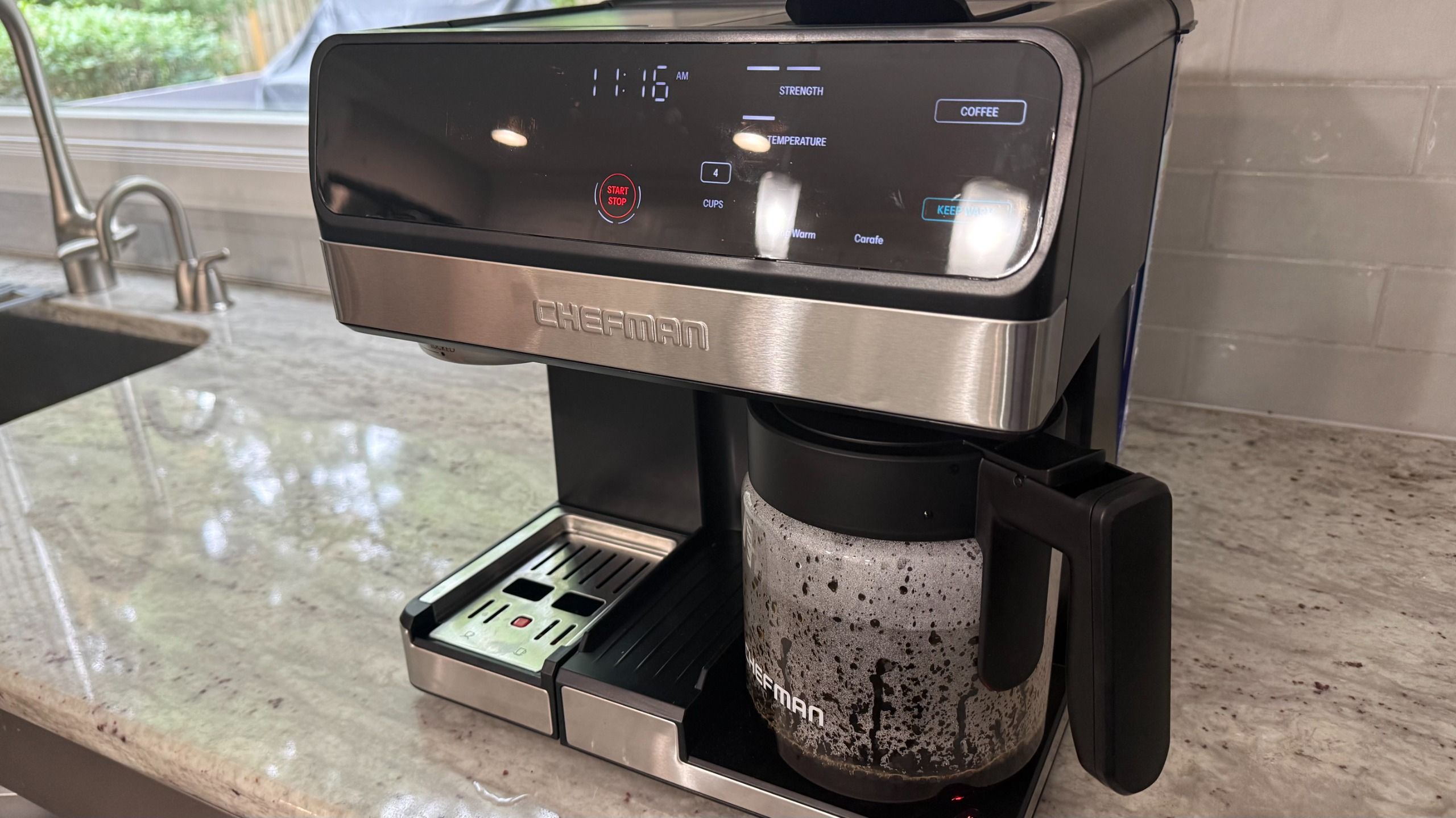 Chefman Coffee Station Pro brewing carafe of drip coffee