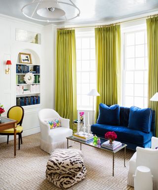 white living room with vibrant color pops to pair with a navy couch