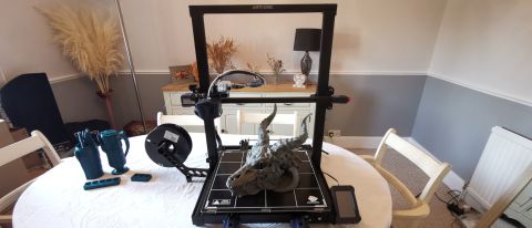 A picture of the Anycubic Kobra Max 3D printer on a large wooden table