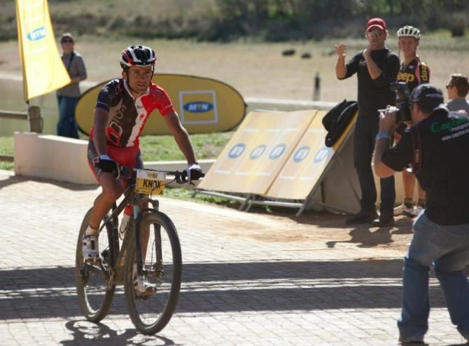 Max Knox rides across the finish line as the winner at the Gravel Travel marathon
