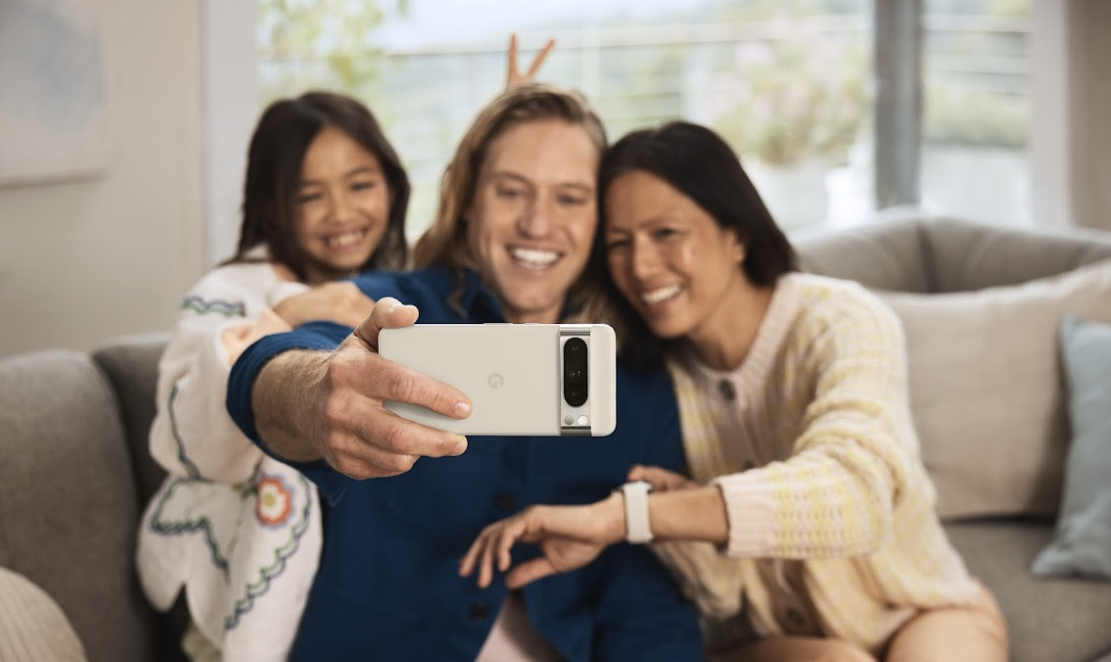 an image of a group of people taking a group selfie with the Pixel 8 Pro