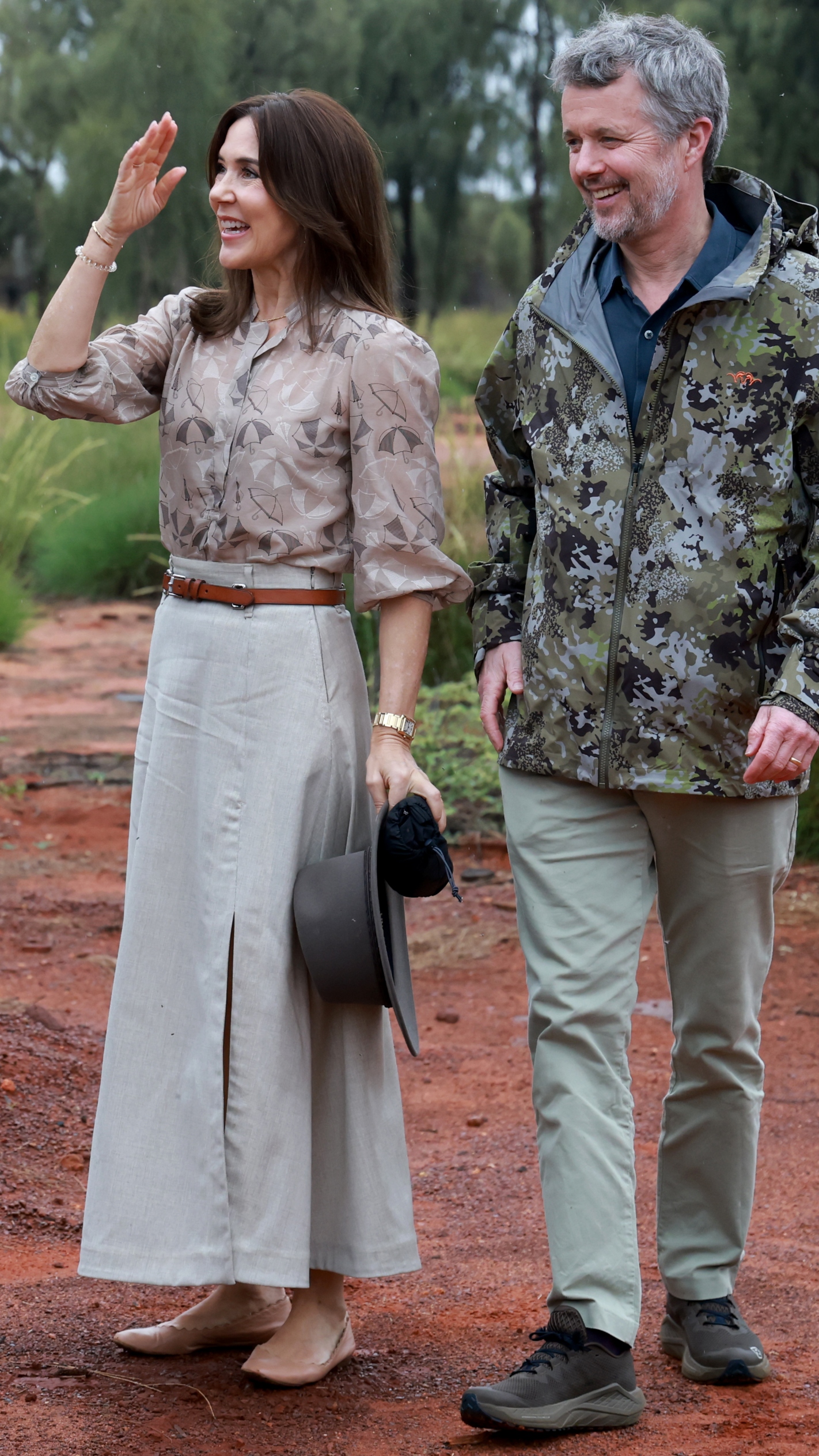 Denmark's King Frederik X (R) and Queen Mary (2/R) are greeted at the Uluru-Kata Tjuta National Park Cultural Centre during their five-day state visit to Australia, on March 14, 2026