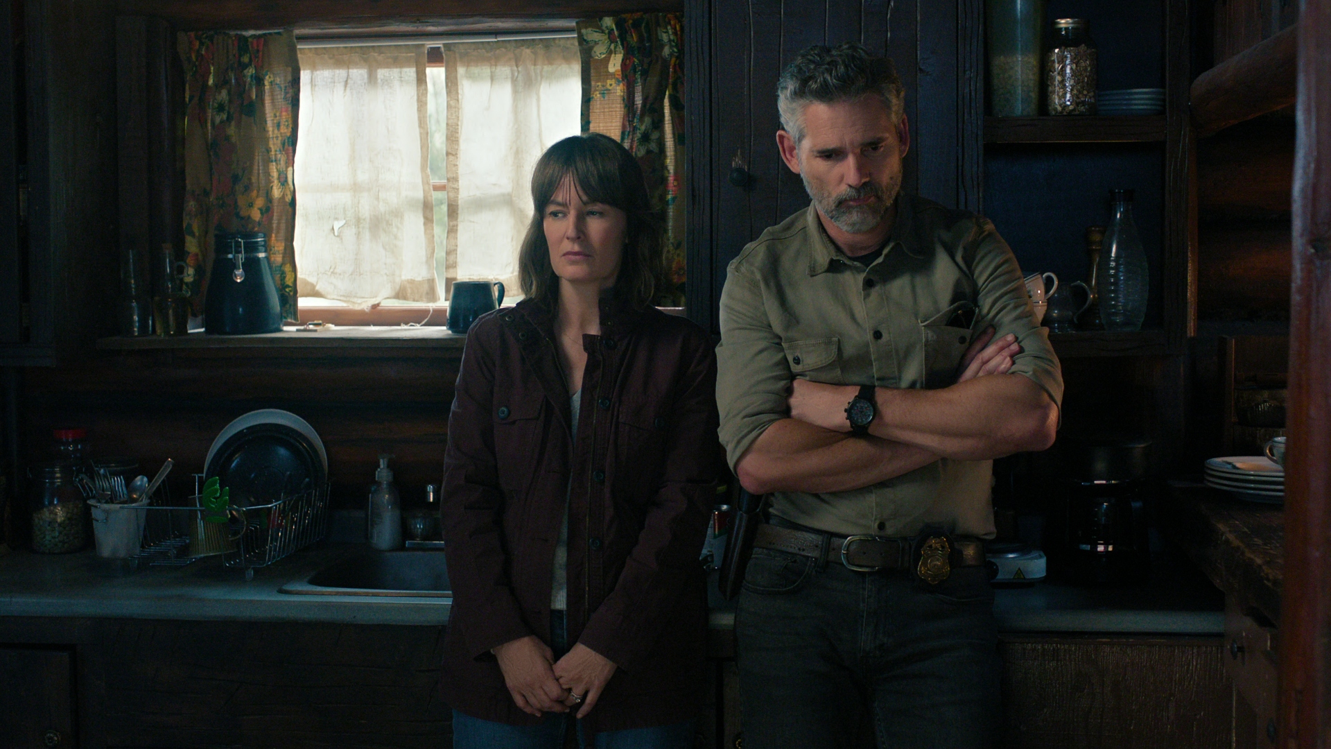 Kyle and Jill stand in the kitchen in Untamed