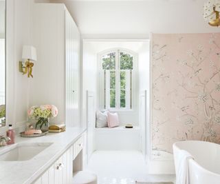 White bathroom with pink wallpaper