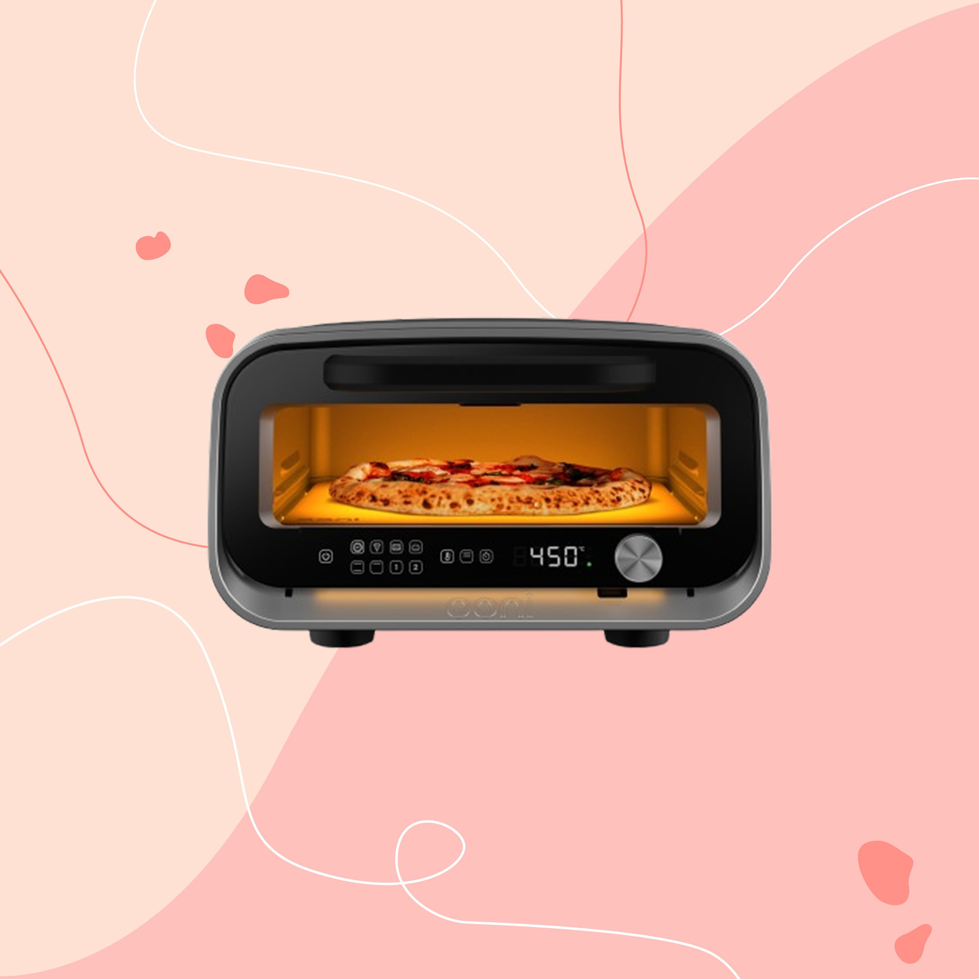 Ooni's new oven on a pink style background