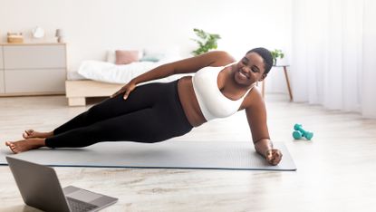 Woman does a side plank 