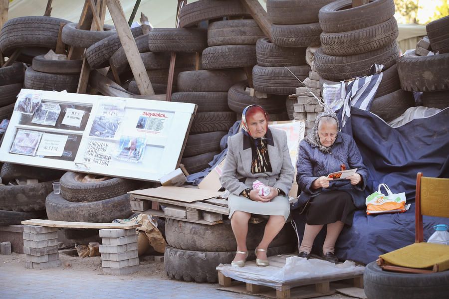 Photos: As tensions mount, a surreal version of everyday life plays out in Ukraine