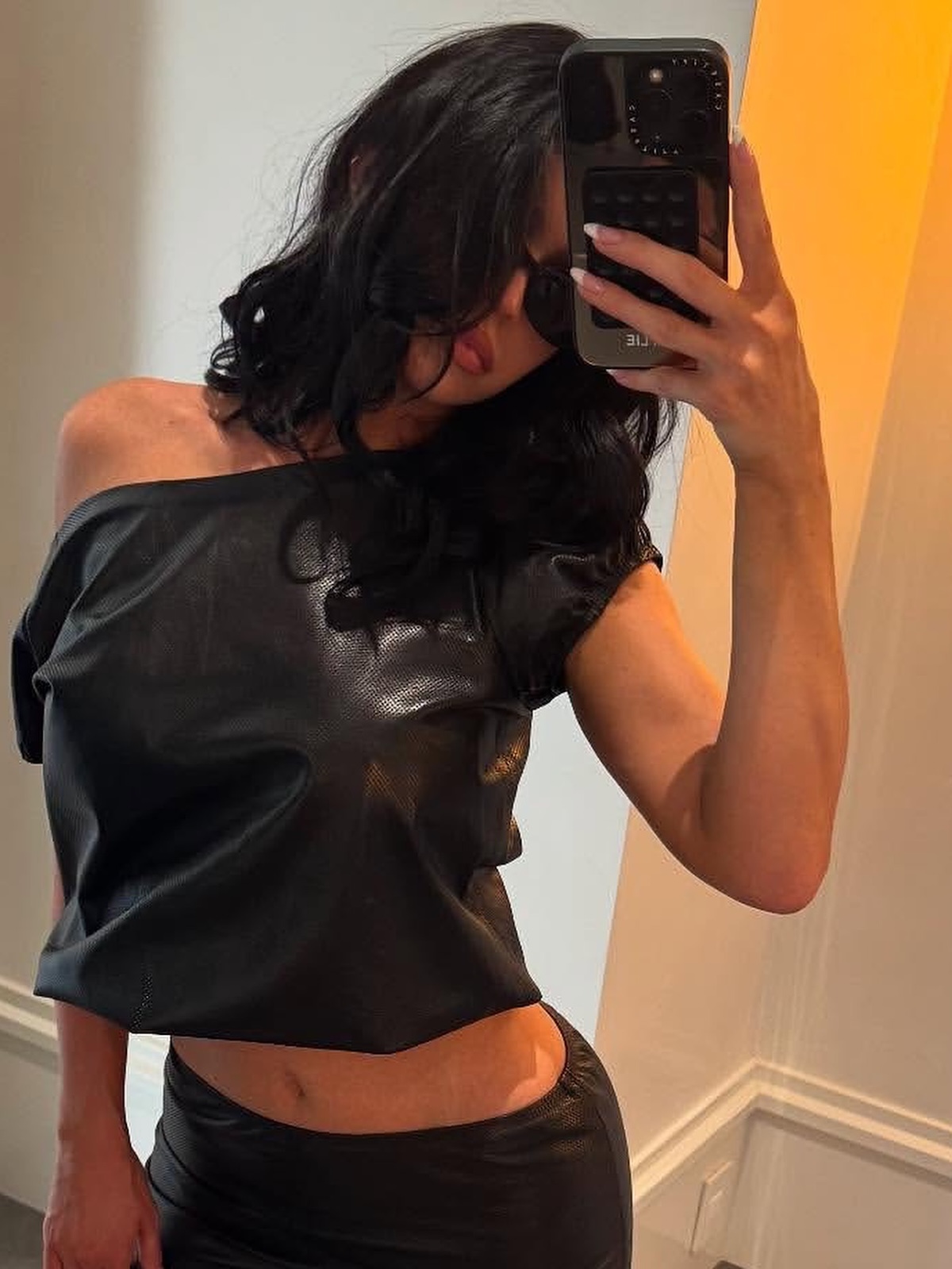 Kylie Jenner taking a mirror selfie