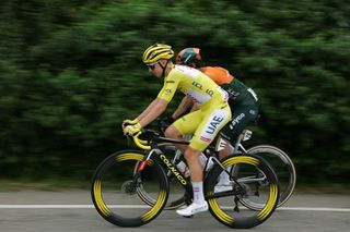 UAE Team Emirates team's Slovenian rider Tadej Pogacar wearing the overall leader's yellow jersey and Team Jayco AlUla team's Australian rider Michael Matthews cycle in the Lombardy region during the 3rd stage of the 111th edition of the Tour de France cycling race, 230,5 km between Piacenza and Turin, in Italy, on July 1, 2024. (Photo by Thomas SAMSON / AFP)