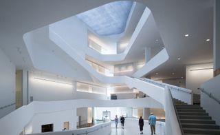 White open hall with staircases to multiple levels