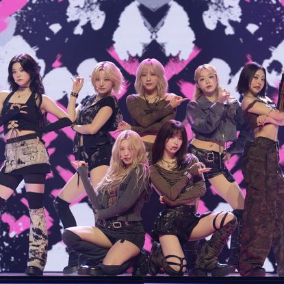 The seven members of Billlie (from left: Tsuki, Siyoon, Haram, Moon Sua, Haruna, Suhyeon, and Sheon) perform in front of an LED screen, on Apple TV+'s 'KPOPPED.'