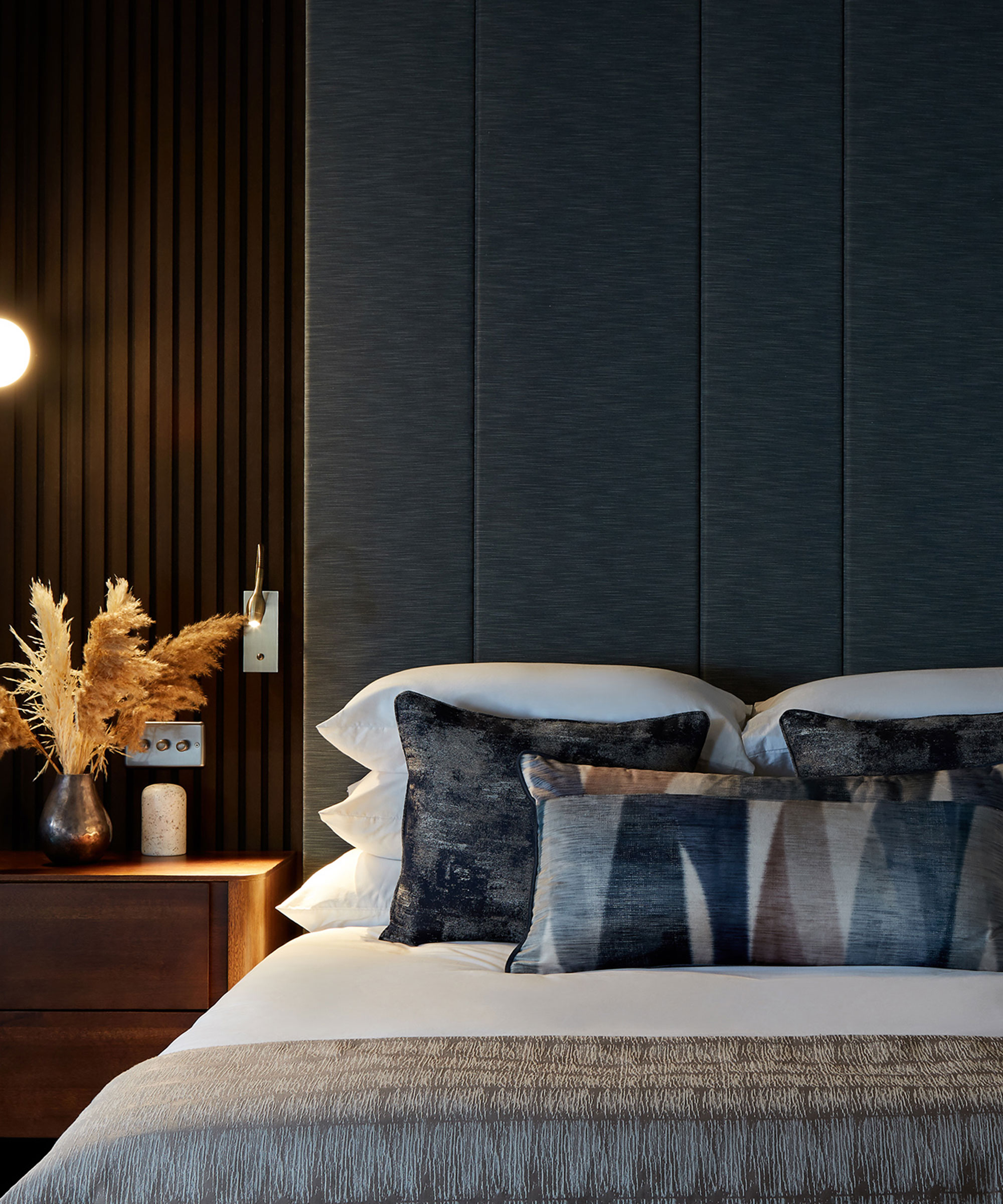 dark grey bedroom with upholstered headboard