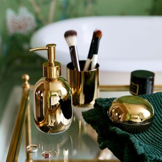 brass accessories with vases and candlesticks toothbrush holder and soap dispenser