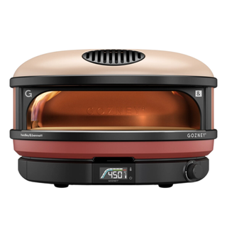 The Arc XL pizza oven in shade 'sunrise' from the Gozney x Hedley & Bennett limited edition collaboration