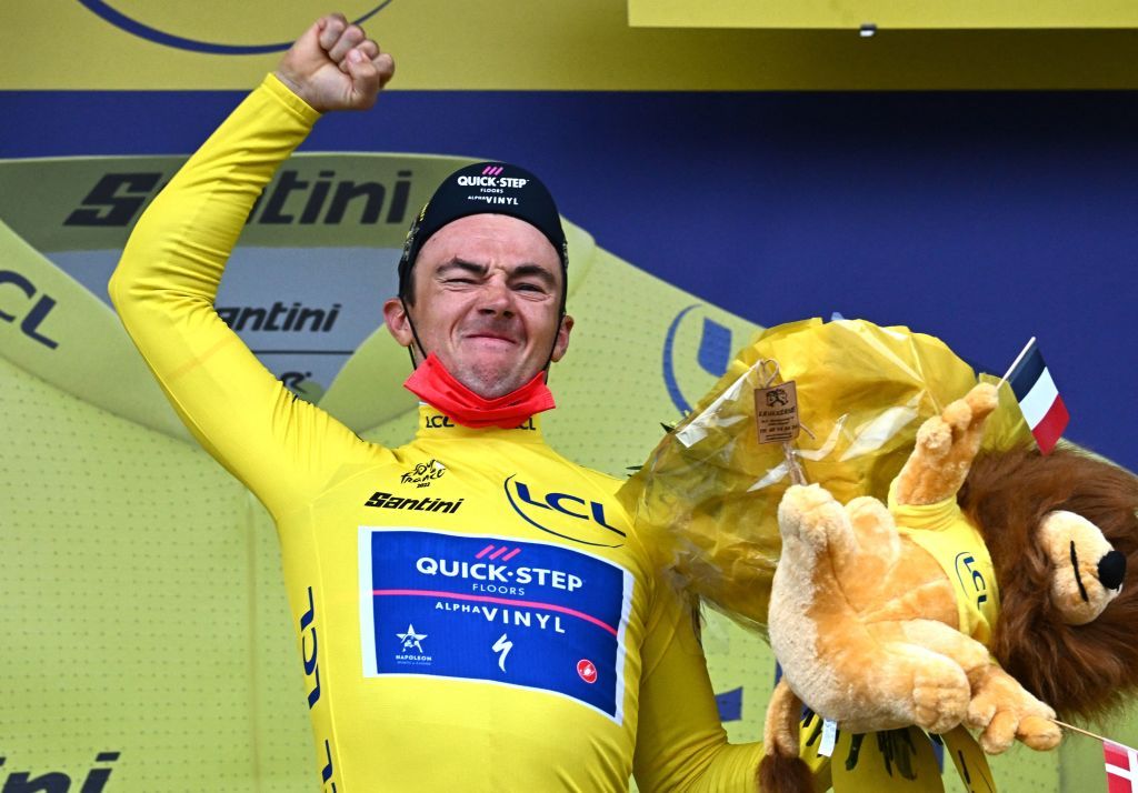 QuickStep Alpha Vinyl Teams Belgian rider Yves Lampaert celebrates with the overall leaders yellow jersey on the podium after the 1st stage of the 109th edition of the Tour de France cycling race 132 km individual time trial stage in Copenhagen in Denmark on July 1 2022 Photo by AnneChristine POUJOULAT AFP Photo by ANNECHRISTINE POUJOULATAFP via Getty Images