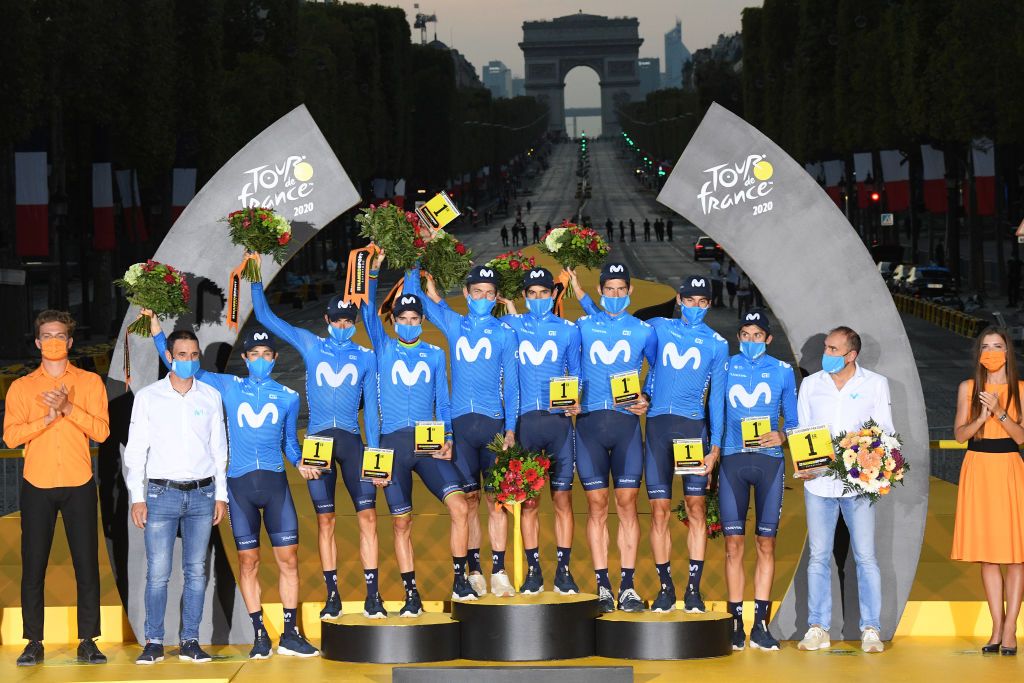 PARIS FRANCE SEPTEMBER 20 Podium Dario Cataldo of Italy Imanol Erviti of Spain Enric Mas Nicolau of Spain Nelson Oliveira of Portugal Jose Joaquin Rojas Gil of Spain Marc Soler Gimenez of Spain Alejandro Valverde Belmonte of Spain Carlos Verona Quintanilla of Spain and Movistar Team Jose Luis Arrieta of Spain Sports director of Movistar Team Pablo Lastras of Spain Sports director of Movistar Team Best Team Celebration Trophy Flowers Mask Covid safety measures during the 107th Tour de France 2020 Stage 21 a 122km stage from MantesLaJolie to Paris Champslyses TDF2020 LeTour on September 20 2020 in Paris France Photo by Stephan Mantey PoolGetty Images