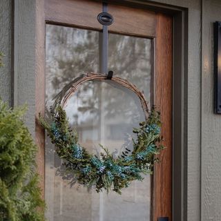 fall wreath hanging on front door