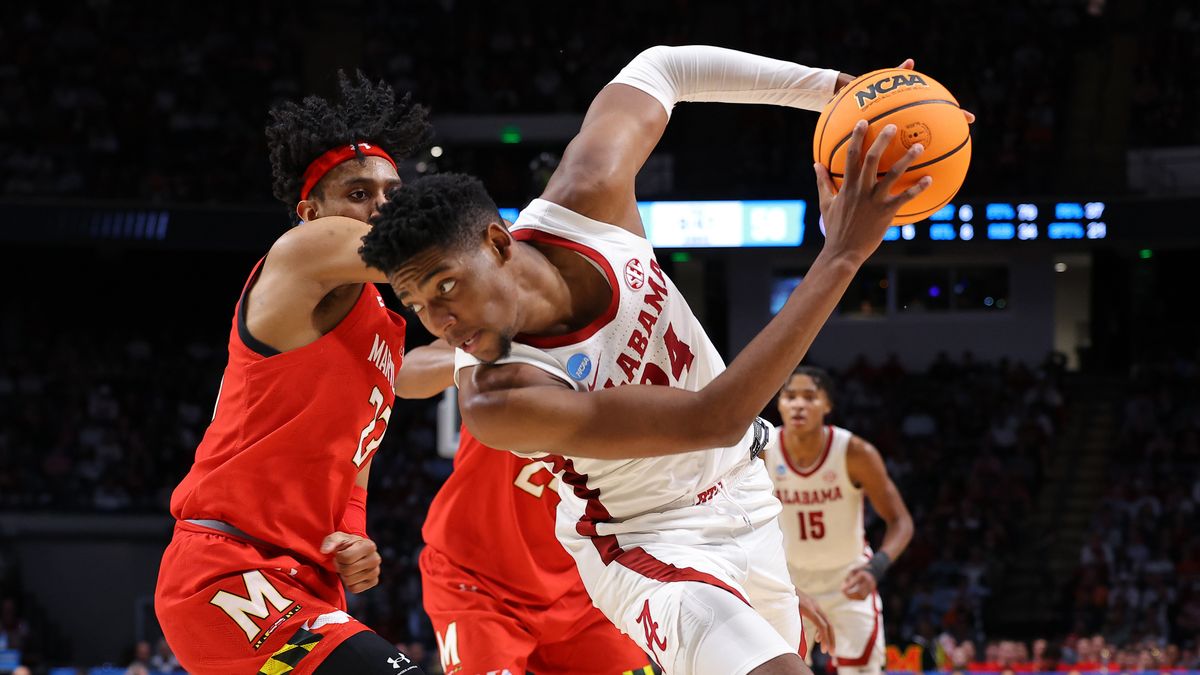 Brandon Miller #24 of the Alabama Crimson Tide drives against Ian Martinez #23 of the Maryland Terrapins during the second half in the second round of the NCAA Men&#039;s March Madness Basketball Tournament at Legacy Arena