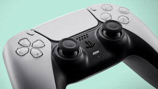 A close up view of the PS5's DualSense controller in white.