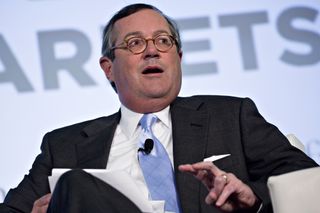 Warren Stephens chats during a press conference