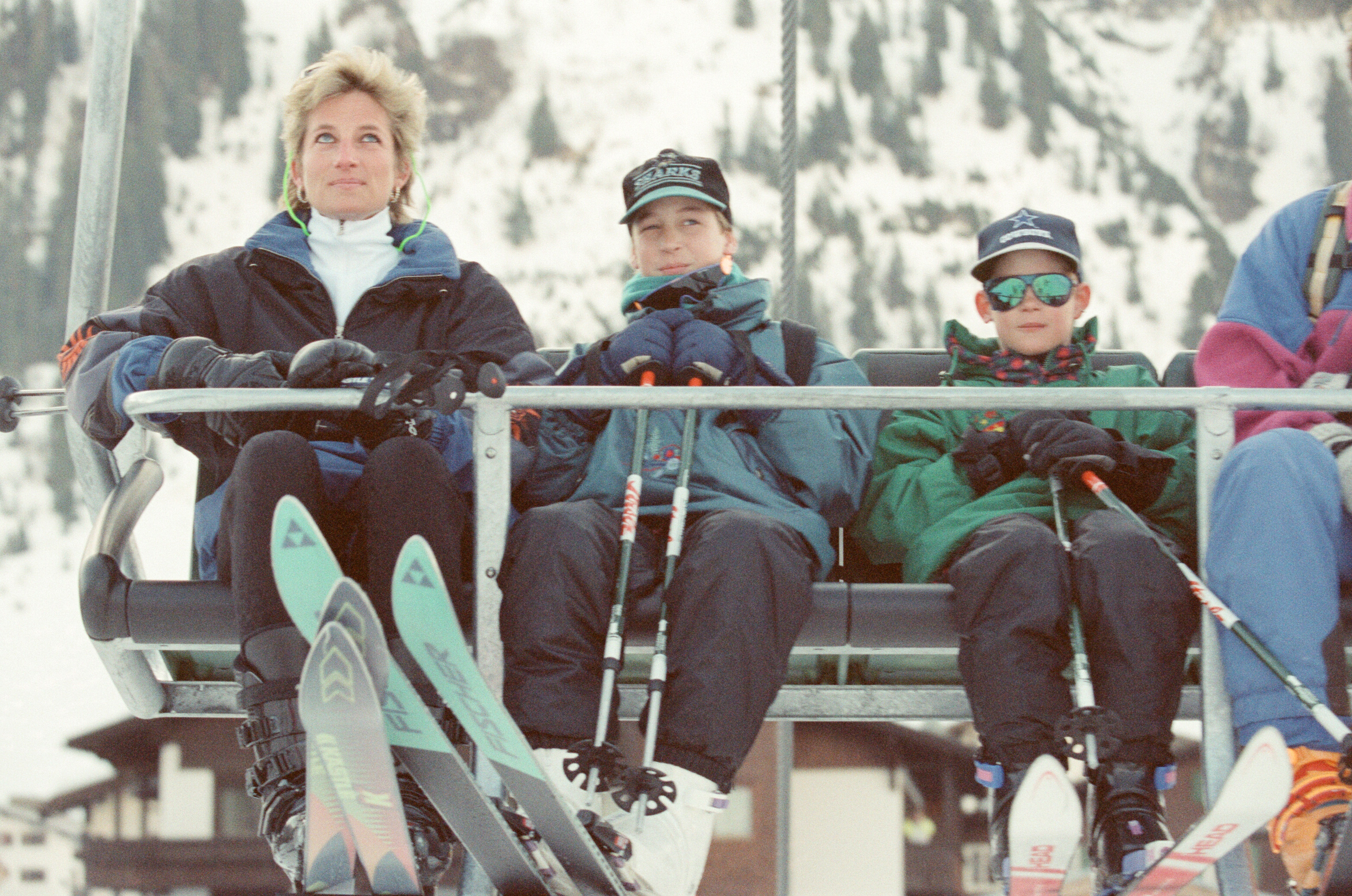 Princess Diana riding in a ski lift with Prince William and Prince Harry