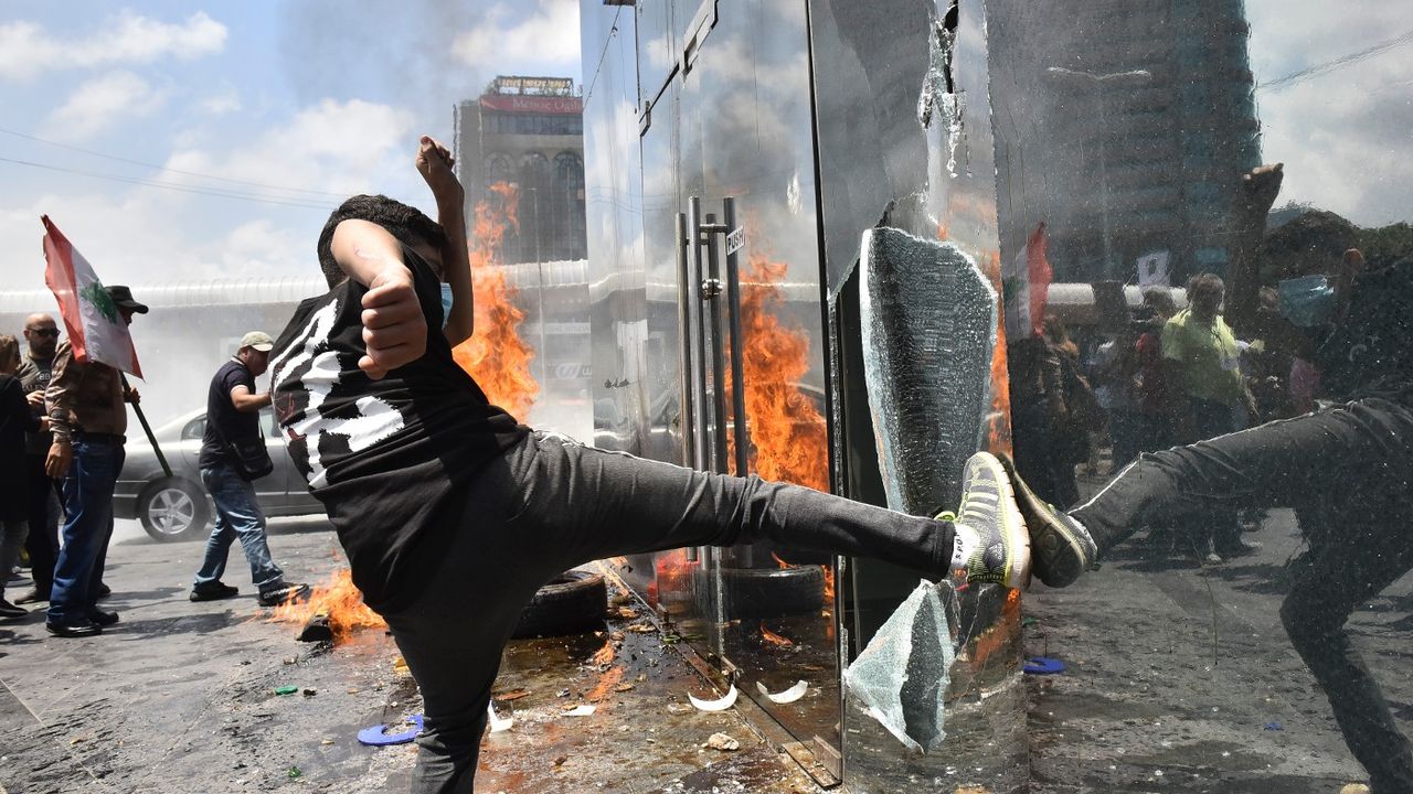 Protesters attacking a bank in Beirut