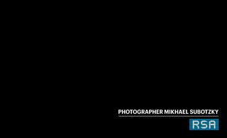 Image of a black rectangle with the wording 'Photographer Mikhael Subotzky' and 'RSA' in white and blue