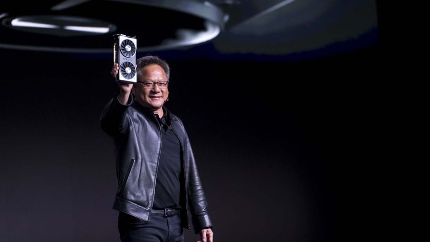 Jen-Hsun Huang, president and chief executive officer of Nvidia Corp., holds up the new Nvidia GeForce RTX 2060 graphics processor during the company&#039;s event at the 2019 Consumer Electronics Show (CES) in Las Vegas, Nevada, U.S., on Sunday, Jan. 6, 2019.