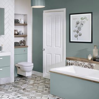 white and sea green bathroom with white door and hanging light with sea green lamp shade