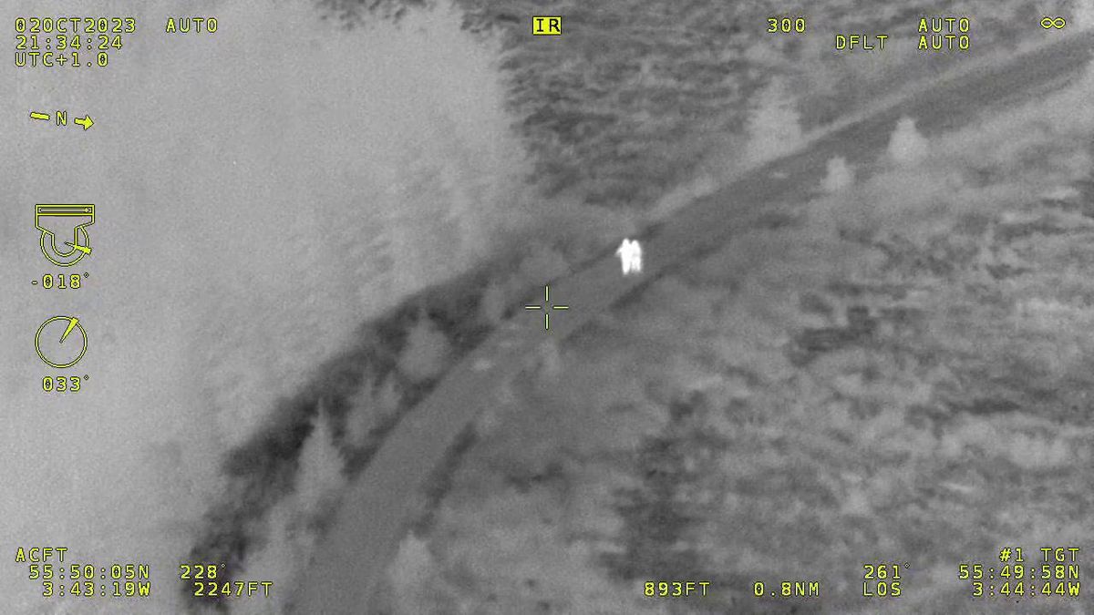 Thermal image of two children lost in Scottish forest with metadata around it