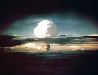 The mushroom cloud from Ivy Mike (codename given to the test) rises above the Pacific Ocean over the Enewetak Atoll in the Marshall Islands on November 1, 1952
