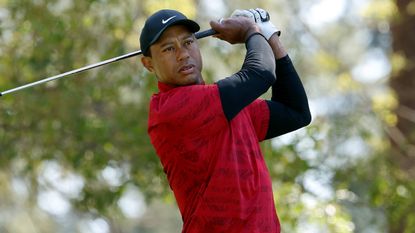 Tiger Woods plays a tee shot during the final round of the 2022 Masters
