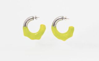 silver and neon green hoop earring by Sunnei